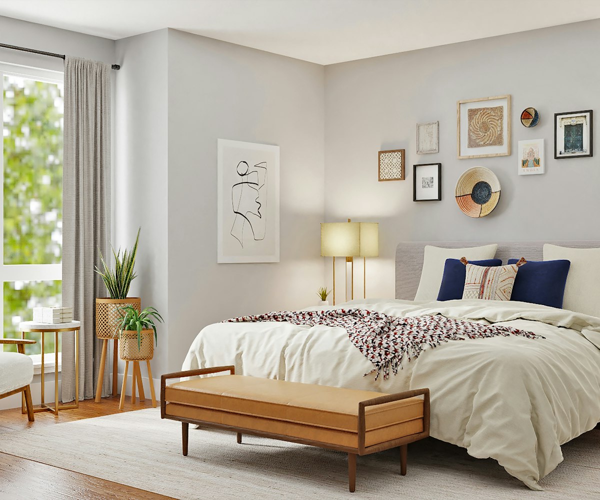 A tranquil neutral bedroom with natural materials and soft bedding
